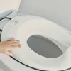 Réducteur de toilette blanc et noir