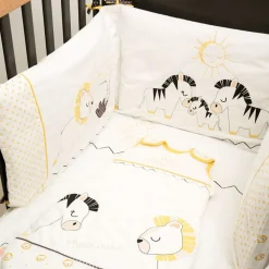 Tour de lit bébé pluche et pompon